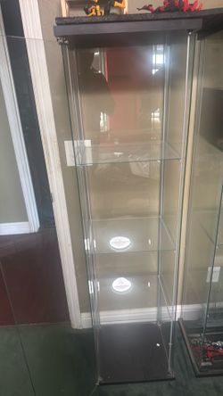 Three IKEA glass cabinets for display