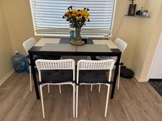 Ikea Black Dining Table with 4 White Chairs