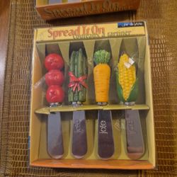Two sets of four each Joe De Vivre Cheese or butter spreaders
