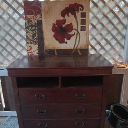 Cherry Wood Dresser With Wall Decor 