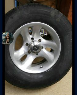 Two Sets Of Rims One Chevy And One After Market