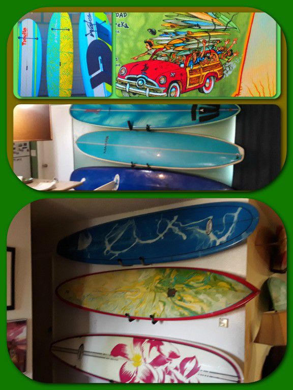Surfboards lots of paddle boards too many different colors lots of these