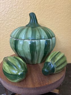 A green ceramic pumpkin set with salt and pepper sakers