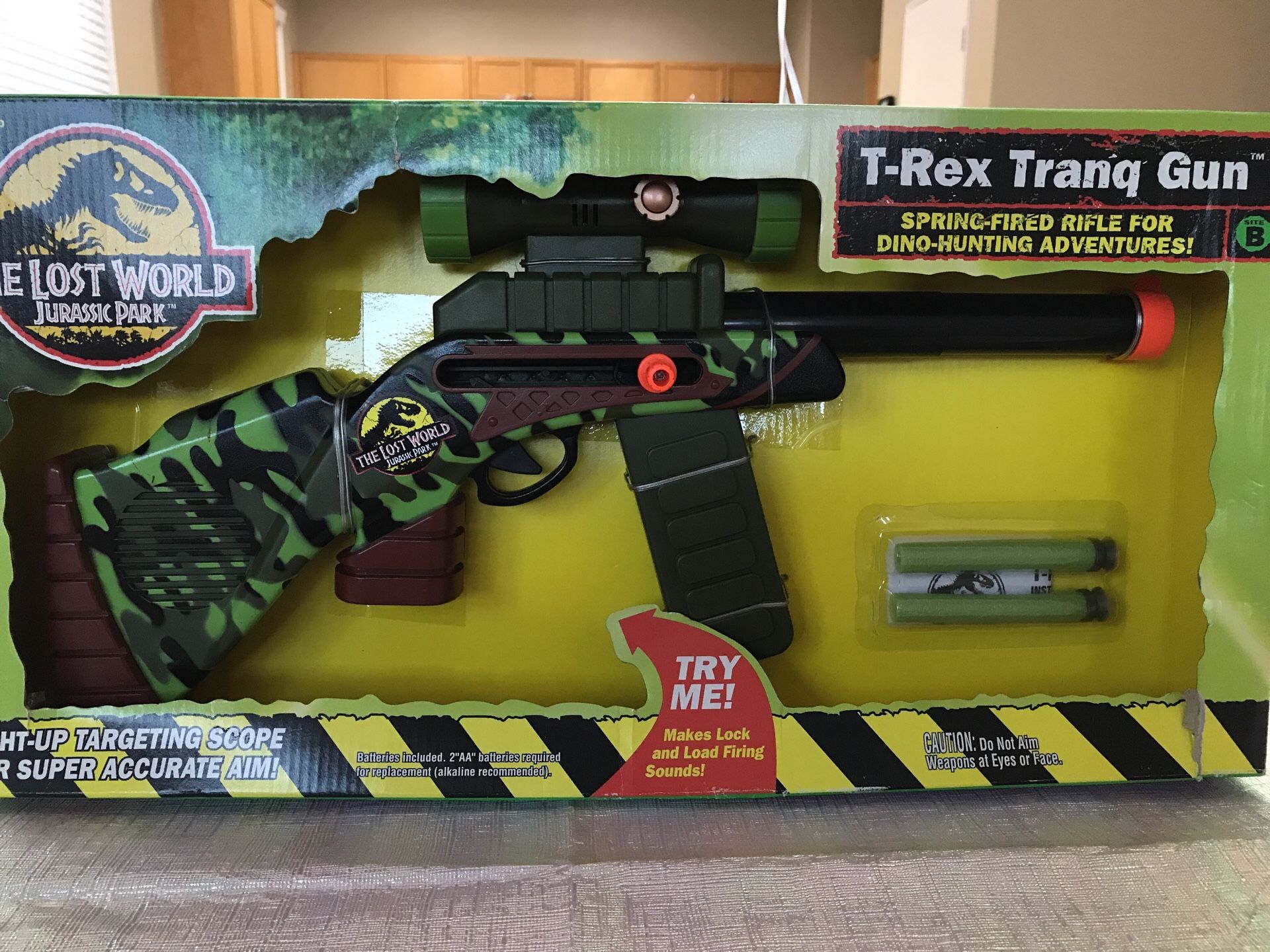 The Lost World Jurassic Park T - Rex Tranquil Gun Spring - Fired Rifle for Dino Hunting Adventure ,also has Light up Targeting Scope for Super Accura