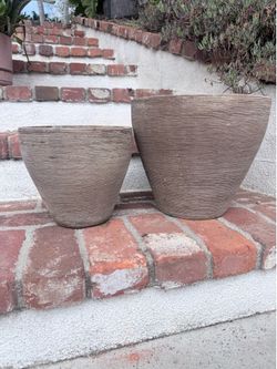 Pair of brown concrete planters