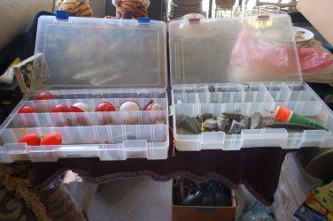 2 BOXES WITH FLOATS AND WEIGHTS, ABOUT 10 LBS TOTAL WEIGHT WITH 2 BOXES. HAS 1 LURE, 1 PLANO, 1 FLAMBEAU