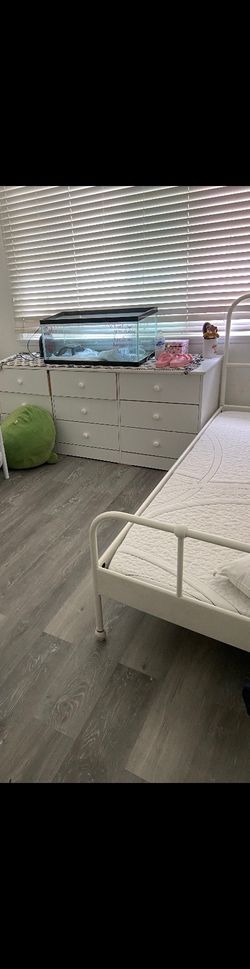 White twin bed frame and mattress