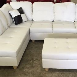 White Leather Sectional couch And Ottoman