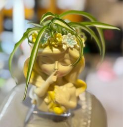 Lovely “Speak No Evil” Girl Planter with Curly Spider Plant