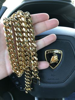 New 14 k yellow gold Cuban link chain and bracelet