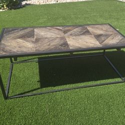 Metal table with decorative wood inlay top