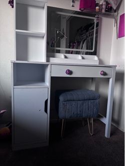 Vanity with light mirror and chair