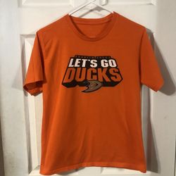 Anaheim Ducks Youth Size large Short Sleeve Tshirt .  The front says “Anaheim Ducks Let’s Go Ducks with the logo.  Preowned Good Condition .  Made Of 