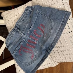 Juicy Couture Jean Mini Skirt With Sequin “Juice” Across The Bum