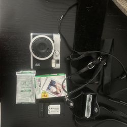 Polaroid Instax Camera, Film, Carrier, Extra Battery And Charger 