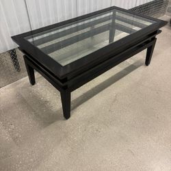 Dark brown, solid wood glass, top coffee table….45” wide , 24” depth , 18 “ high $60