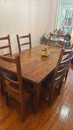 solid mahogany dining table and 6 chairs