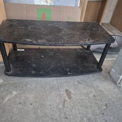 Furinno Turn-N-Tube no tools 2-tier elevated TV stand in a black finish. 