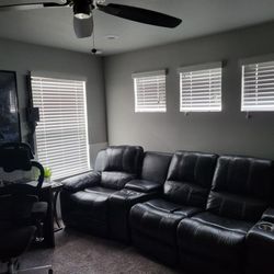 Black leather sectional  and ottoman 