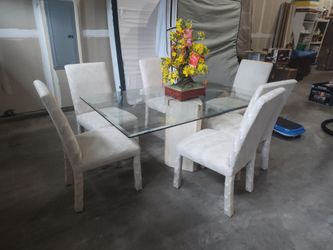 Glass dinner table with chairs