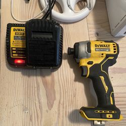 ATOMIC 20V MAX  Cordless Brushless Compact 1/4 in. Impact Driver (Tool and charger only) Dewalt drill used my batter to test it my battery is not incl
