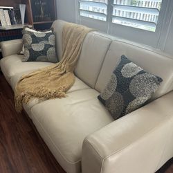 Natuzzi tan sofa with nice comfortable sleeper. 