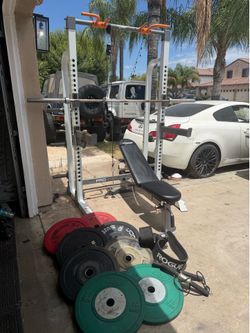 Bench press/squat rack with 7ft 45lbs bar plus 248lbs of Olympic bumper weights