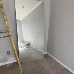 A piece of 35” x 75” mirror. 