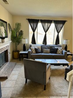 Gray Sofa with nailhead trim detail