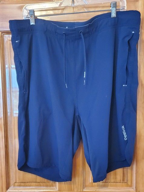 REEBOK Men’s Athletic workout shorts Cobalt Blue Size M Pockets Elastic & Drawstring waistband Side slits Sweat wicking fabric Made in China RN 117