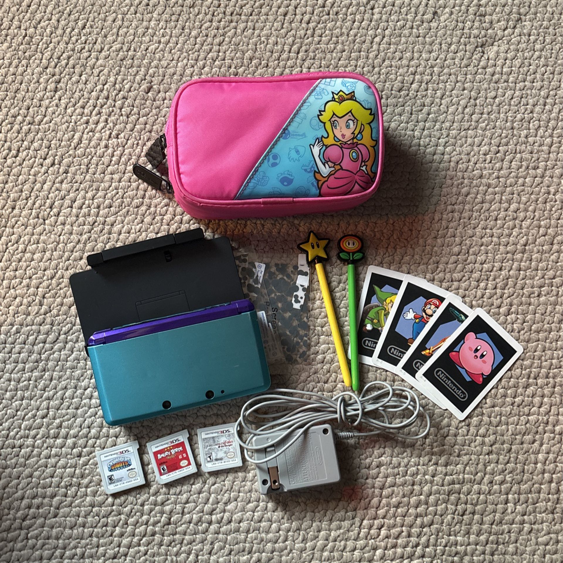 Nintendo 3DS with charger and games