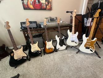 FENDER Stratocaster-Squier models- Cleaned, adjusted and set up with new strings.