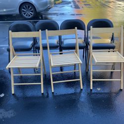 7 Folding Chairs(3)Wood(4)Metal W/Black Cushion(See & Click On Pictures). Still In Good Condition And Useable 