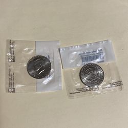 Two new half-dollar coins in the package, never opened, from 2003. I'm asking for $15 for the two collector coins.
