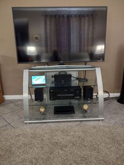 TV stand tempered glass and steel 40 in wide glass top and four glass shelves