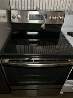 GE stainless steel glasstop electric stove(free delivery)
