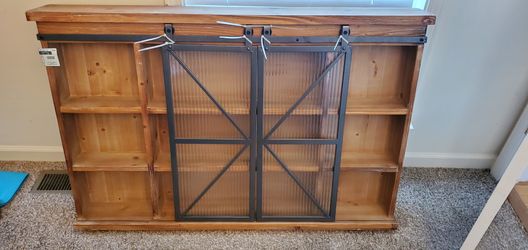 Farmhouse style wall mount shelves with glass barn doors