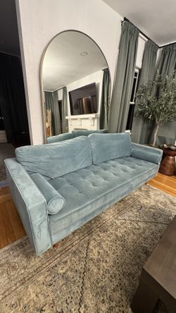 Midcentury modern velvet blue couch with two pillows