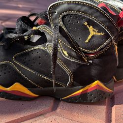 Kids Air Jordan retro  7 black/red/yellow size 1 gently used