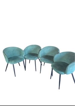 Comfy velvet barrel-back dining chairs