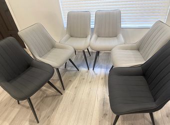 6 light gray and 2 dark blue chairs