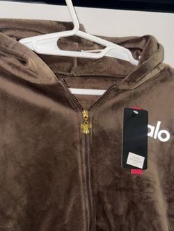 Set Two Pieces sweater with hood and pants with the logo printed on them