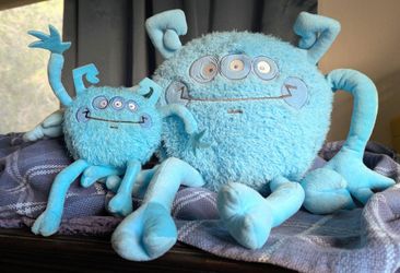 A Set Of Two Blue Monster Plush Toys