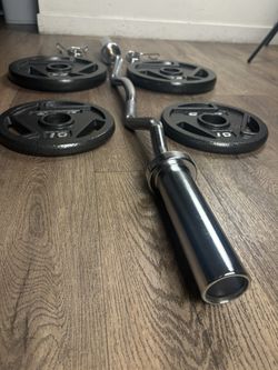 Beautiful BRAND NEW Curl Bar With Pair Of 25s And 10s 