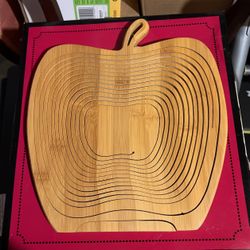its an apple basket lays flat to be used as a trivet