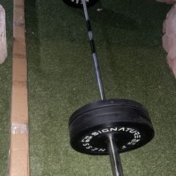 Barbell 2-Inch Olympic 7 ft Barbell Bar and 6 Weights 25 Pound Plates Asking $285  Bar Is 35.2 Lbs 