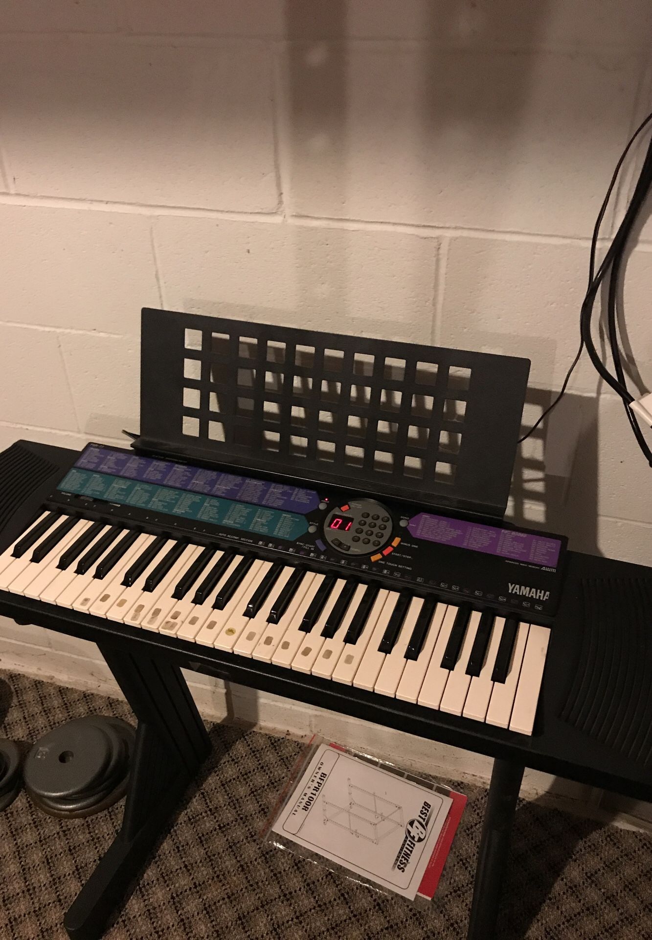 Yamaha PSR-77 Keyboard with powercord, stand and notebook holder. Still sell for $219 on Amazon