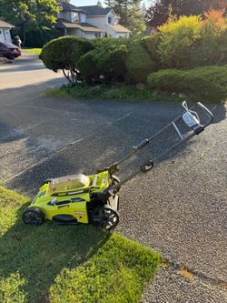 Ryobi mower, leaf blower, batteries and bag included