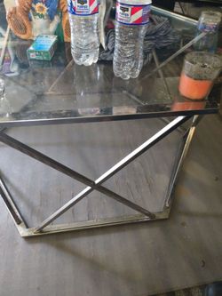 Three glass tables