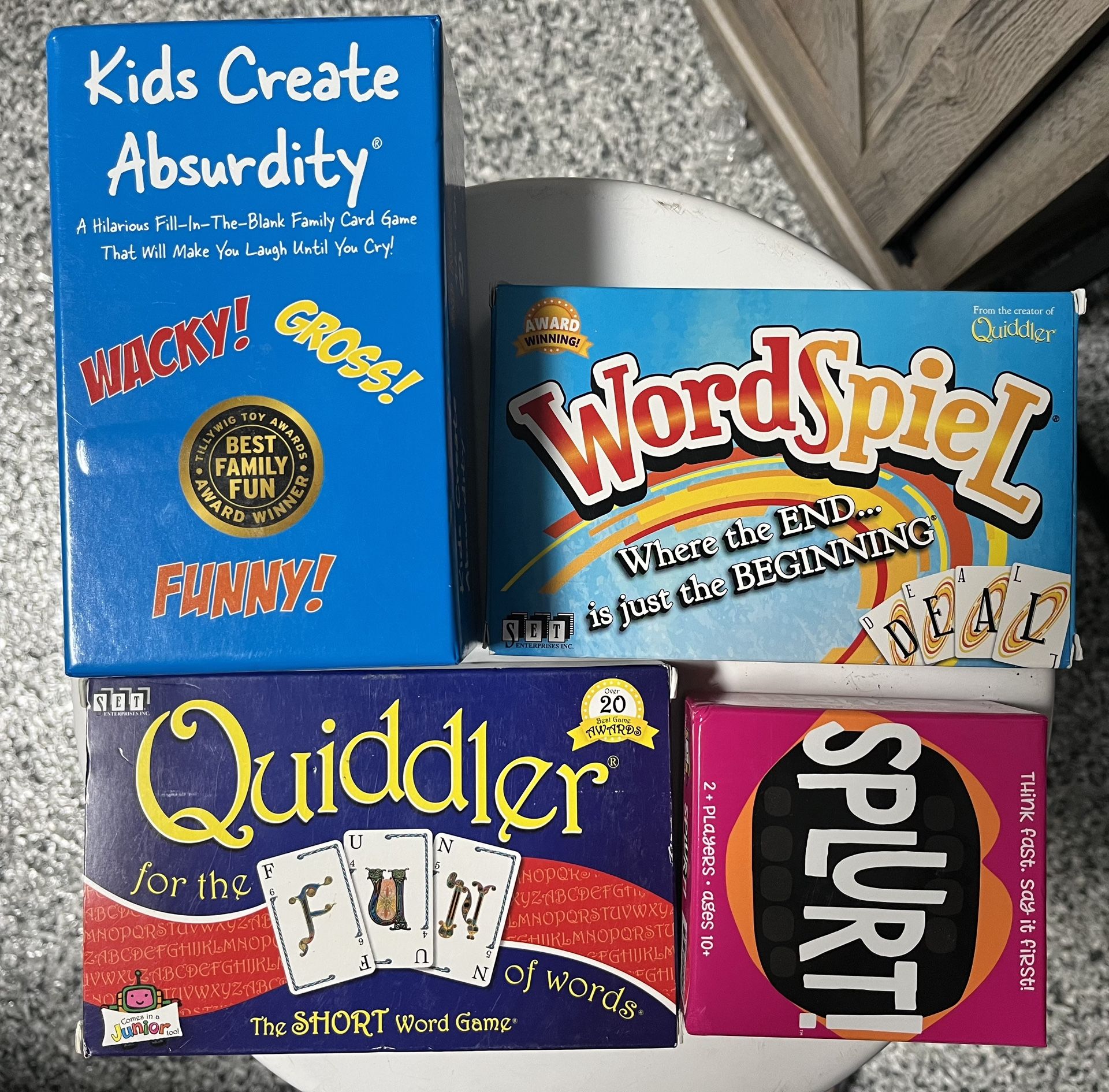 5 Different Card Game. Worspiel, Splurt, Quiddler, Kids Create Absurdity & Guess in 10 Cities Around The World 5 of card games. 8 each. All for 35 Wo